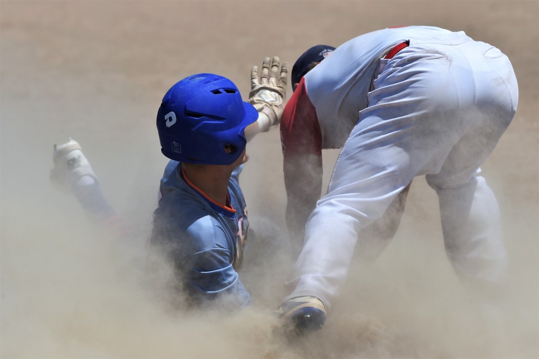 #10 safe into 3rd in a cloud of dust, call for time. Extends ralley.